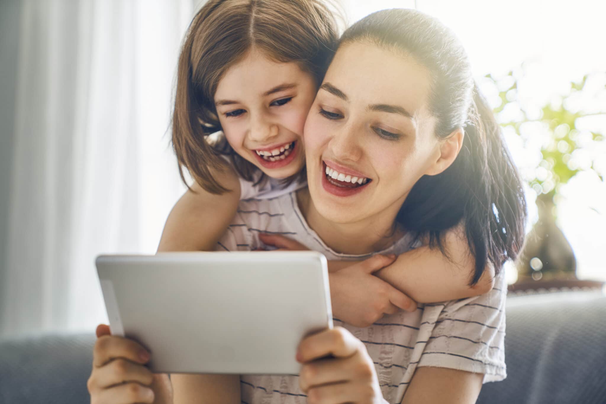 mom and child with tablet